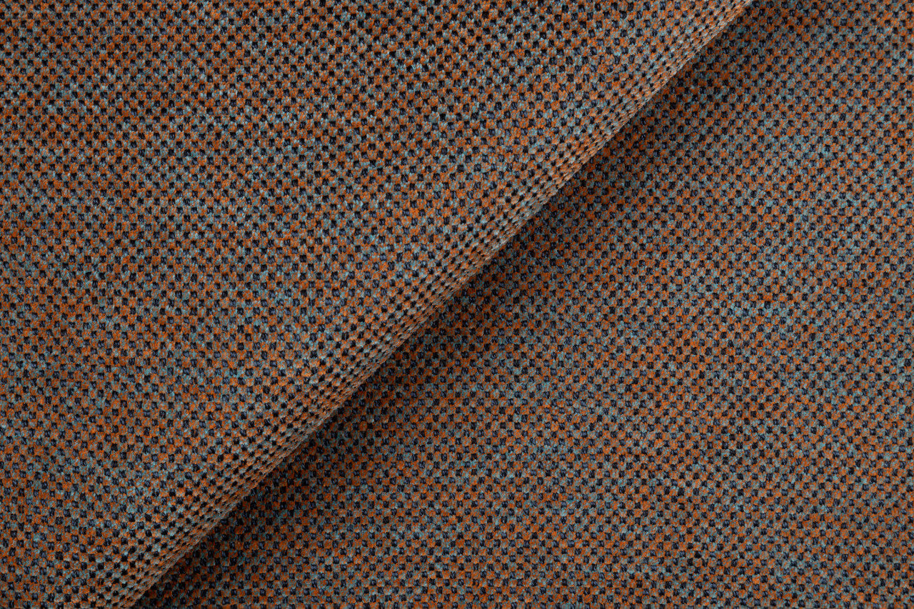 Detail oranžovo-sivej poťahovej látky